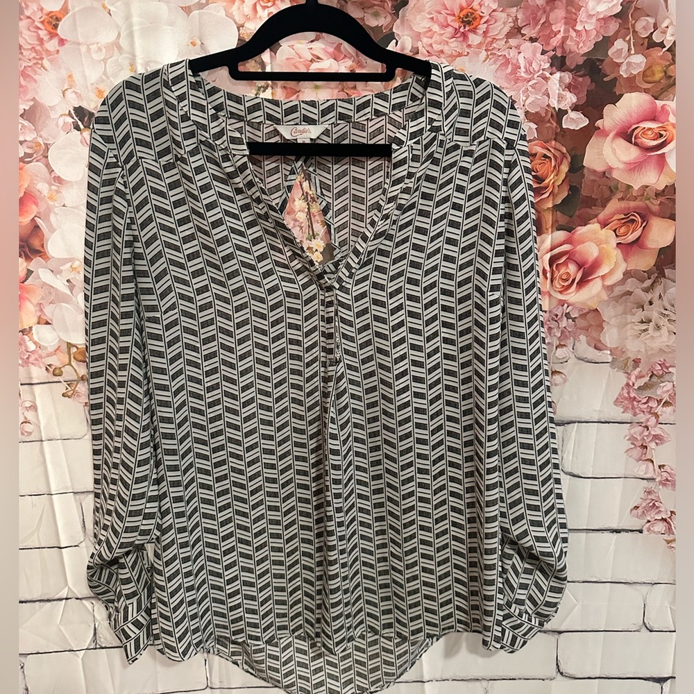 Lightweight loose black and white blouse with small back opening. Size Medium.